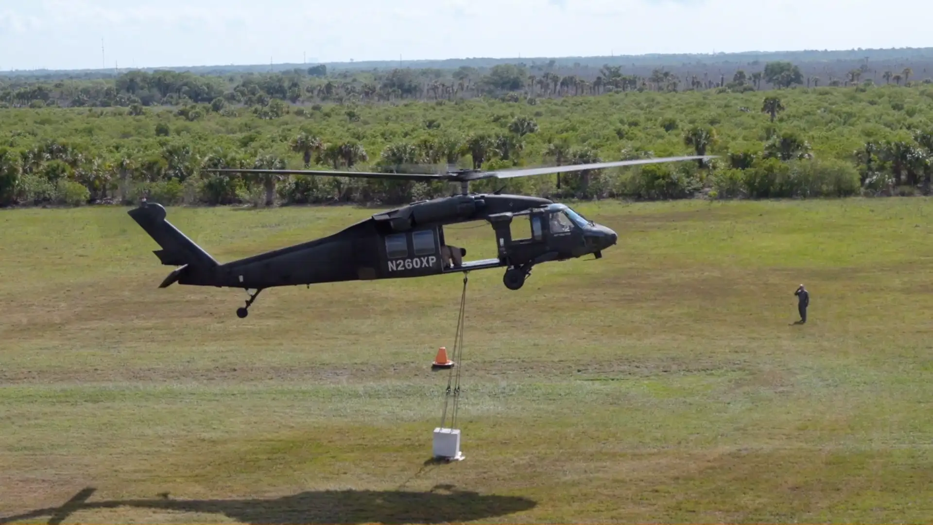 UH-60 performing tactical insertion during daytime ops